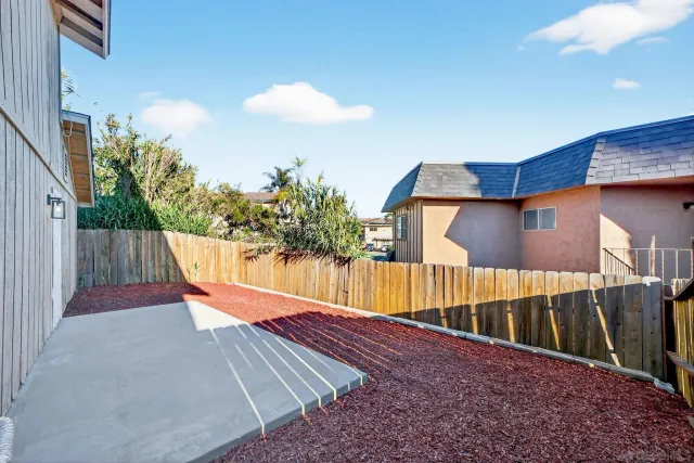 a view of backyard of small house