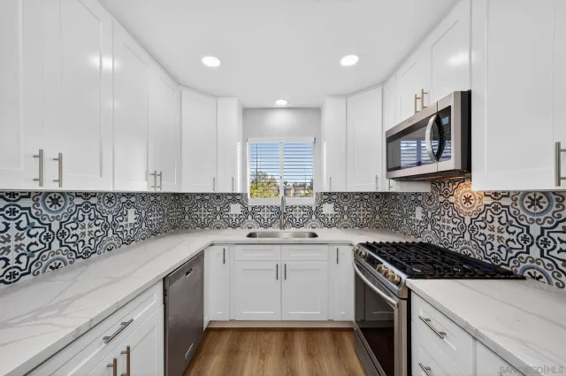 a kitchen with a refrigerator sink and microwave