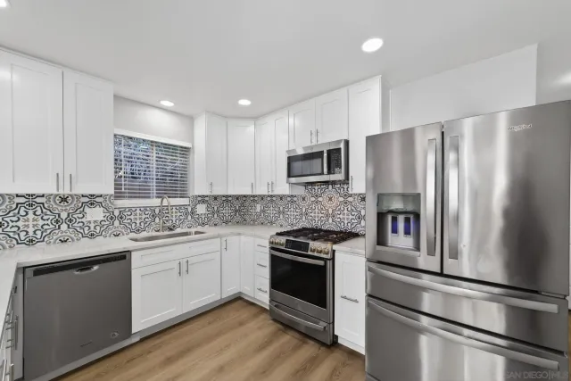 a kitchen with a sink and cabinets
