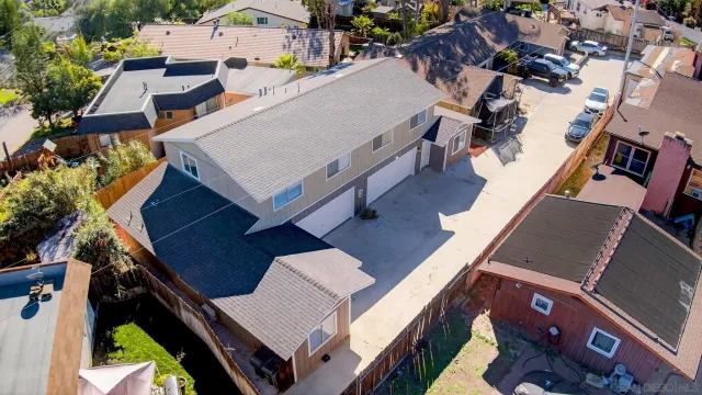 an aerial view of a house with swimming pool
