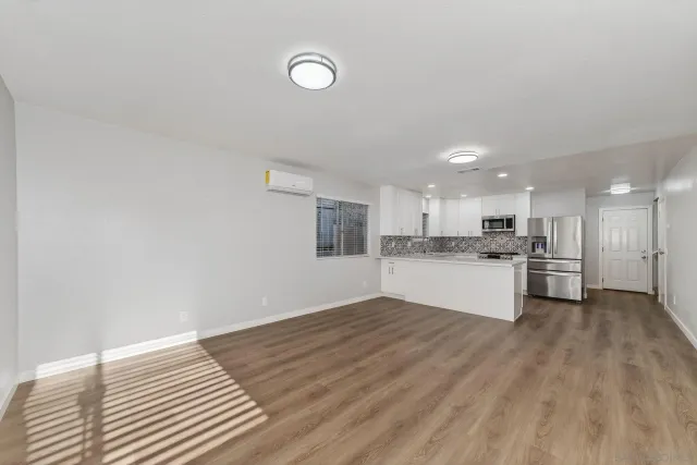 a view of kitchen with wooden floor