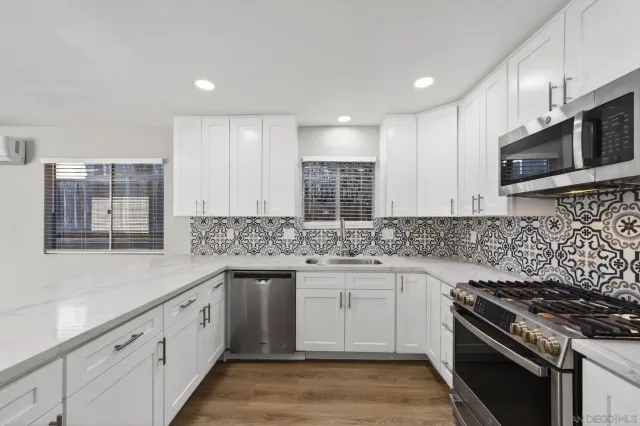 a kitchen with a sink and cabinets