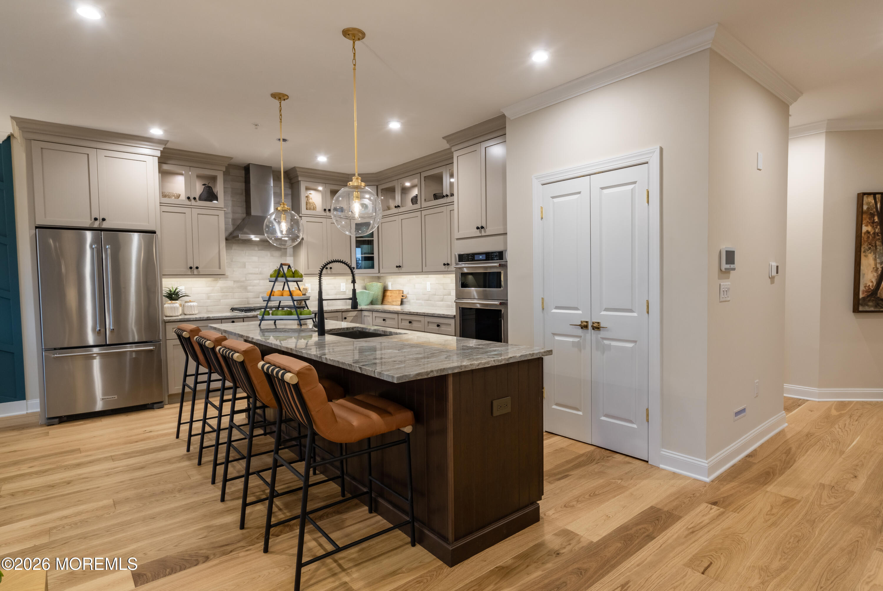 5 American Way Manalapan, NJ 07726 - Photo 2 of 8 a kitchen with stainless steel appliances granite countertop a refrigerator a sink dishwasher and a stove with wooden floor