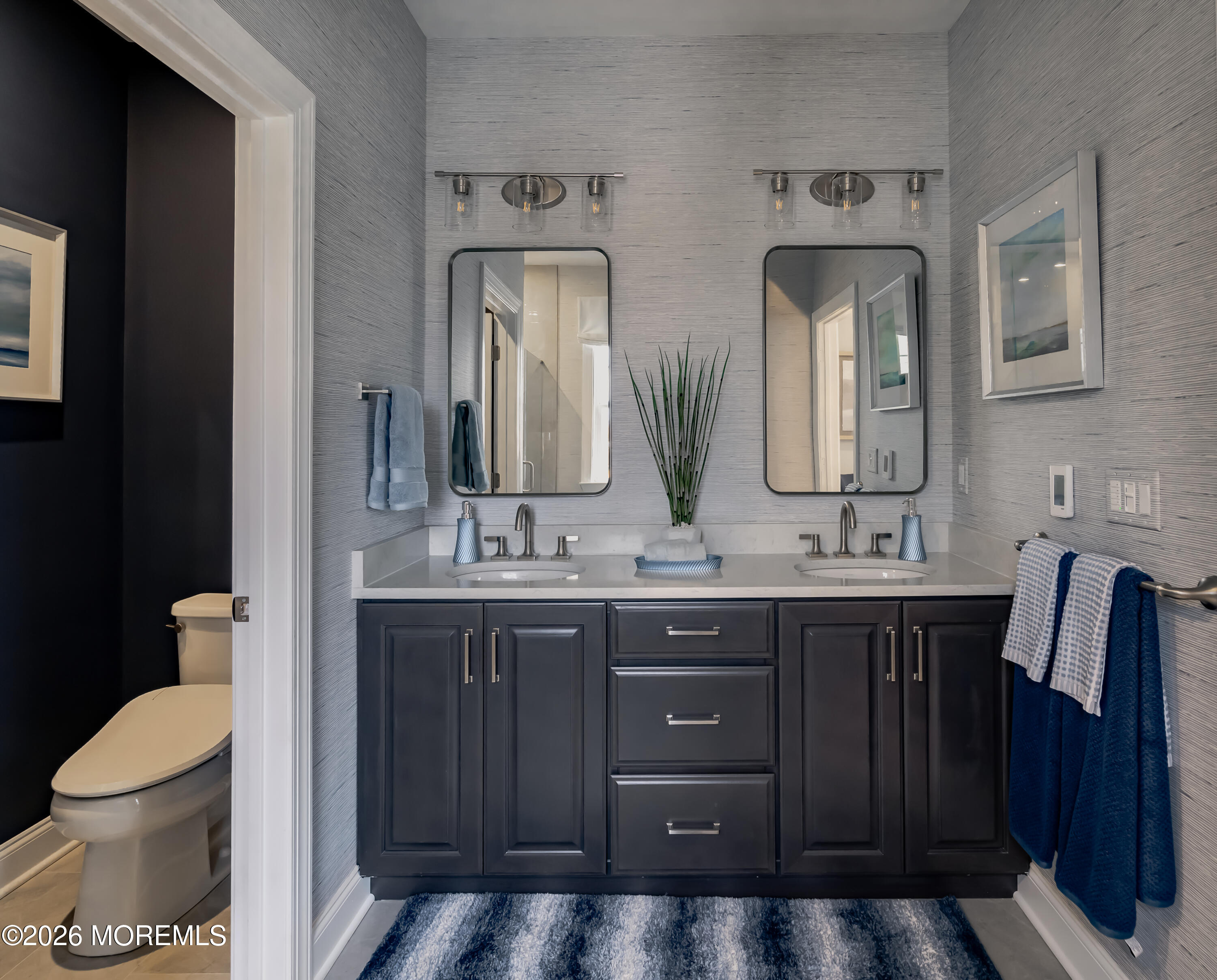 5 American Way Manalapan, NJ 07726 - Photo 5 of 8 a bathroom with a double vanity sink and a toilet