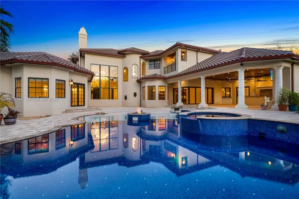 a front view of a house with swimming pool