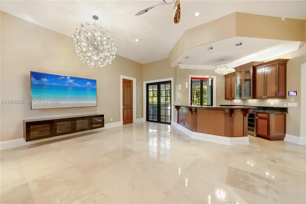 a kitchen with stainless steel appliances granite countertop a sink a stove and a refrigerator