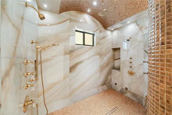 a kitchen with stainless steel appliances a refrigerator and a stove