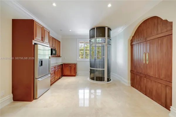 a kitchen that has a sink and a stove in it