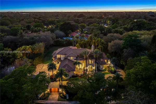 a view of a lake in middle of the forest