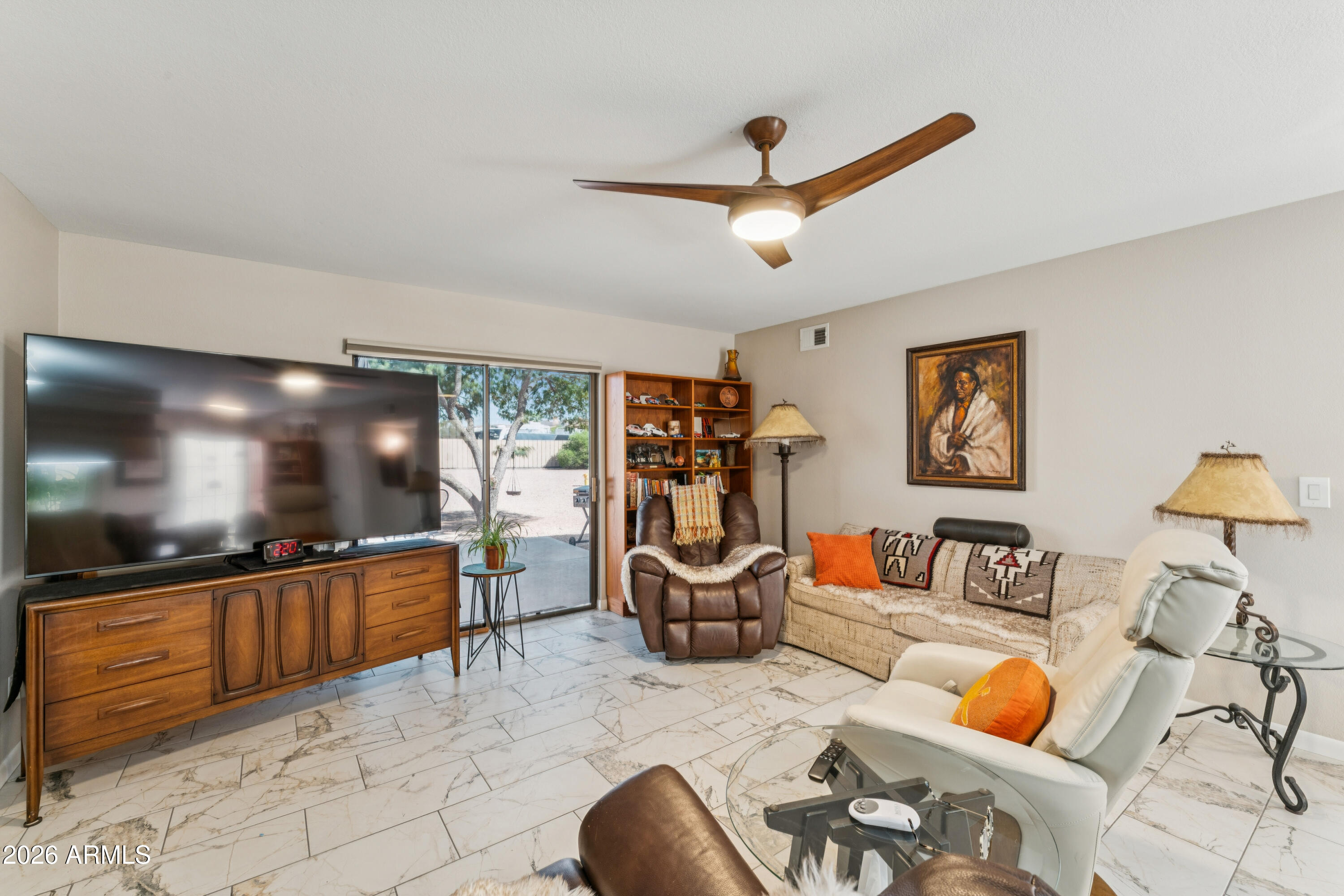 6027 South Alameda Road Gold Canyon, AZ 85118 - Photo 14 of 27 a living room with furniture and a flat screen tv