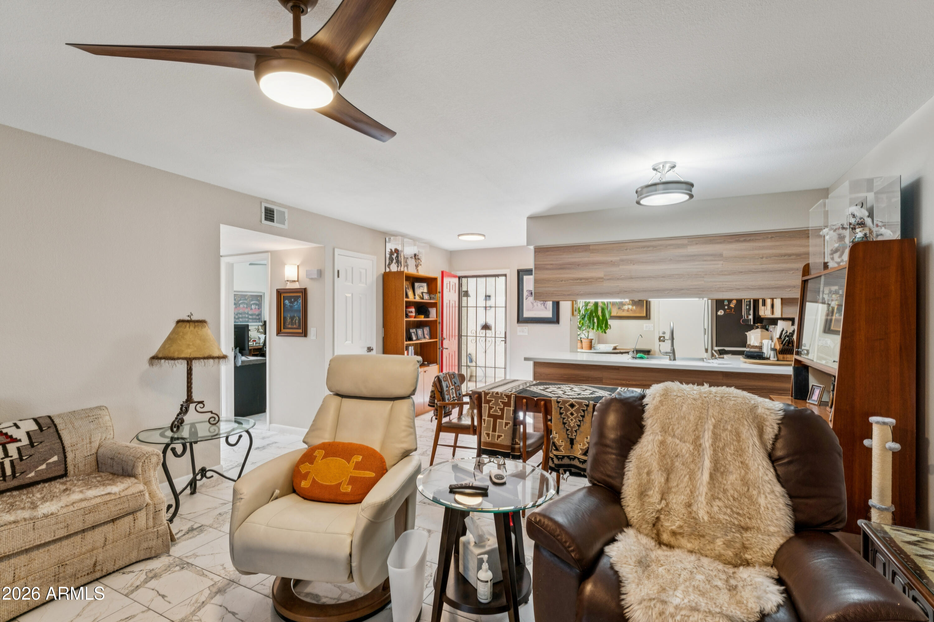 6027 South Alameda Road Gold Canyon, AZ 85118 - Photo 15 of 27 a living room with furniture and wooden floor