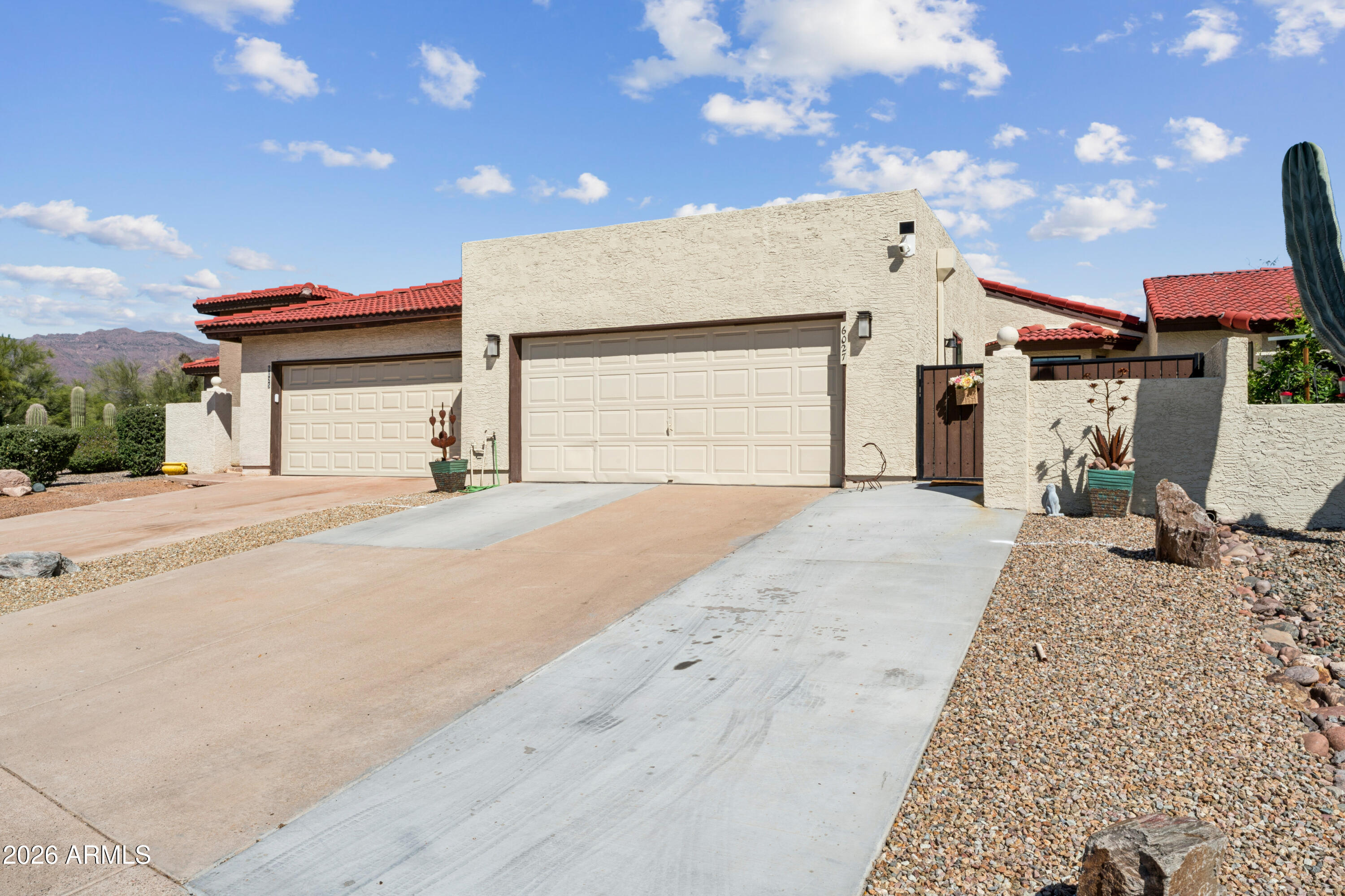 6027 South Alameda Road Gold Canyon, AZ 85118 - Photo 2 of 27 a view of a house with a patio