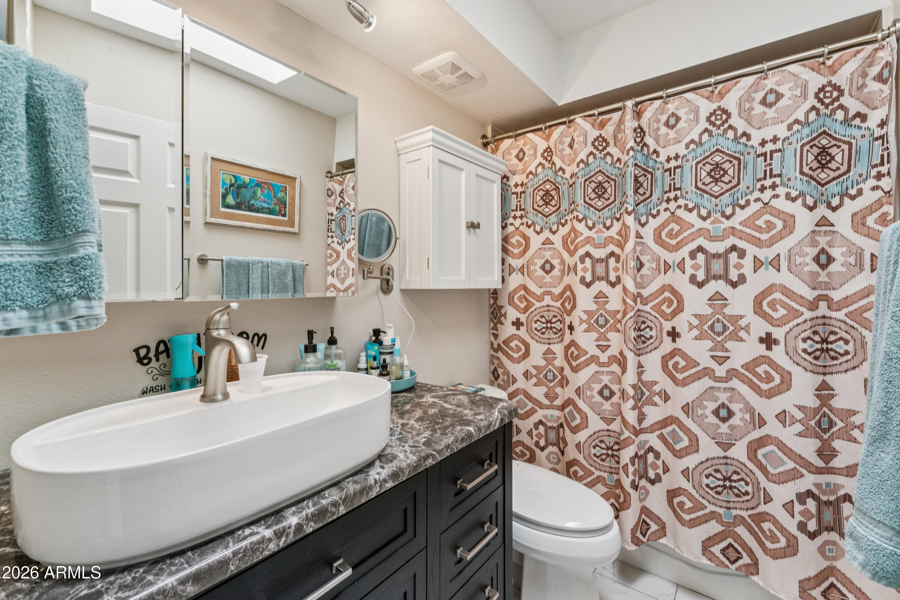 6027 South Alameda Road Gold Canyon, AZ 85118 - Photo 22 of 27 a bathroom with a granite countertop sink and a mirror