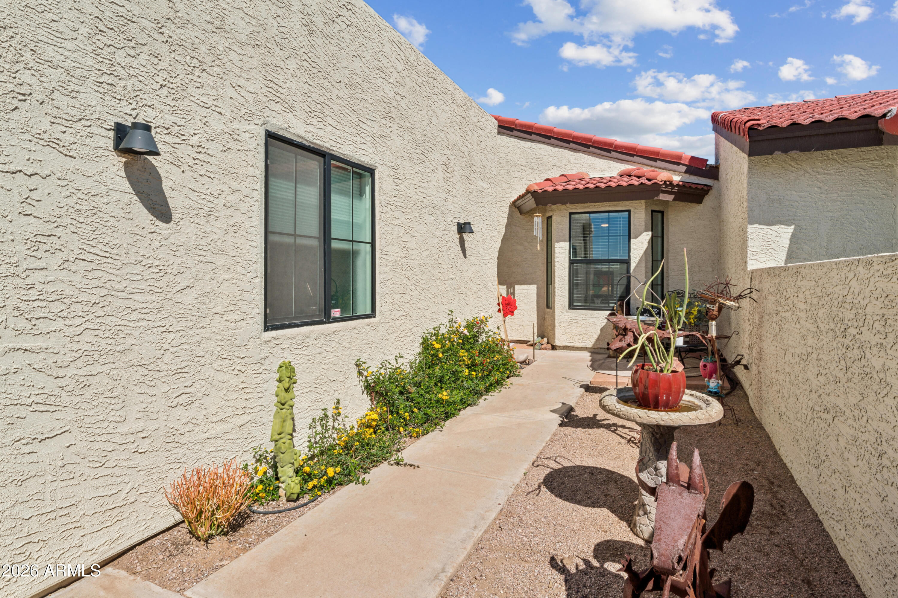 6027 South Alameda Road Gold Canyon, AZ 85118 - Photo 4 of 27 a front view of a house with patio