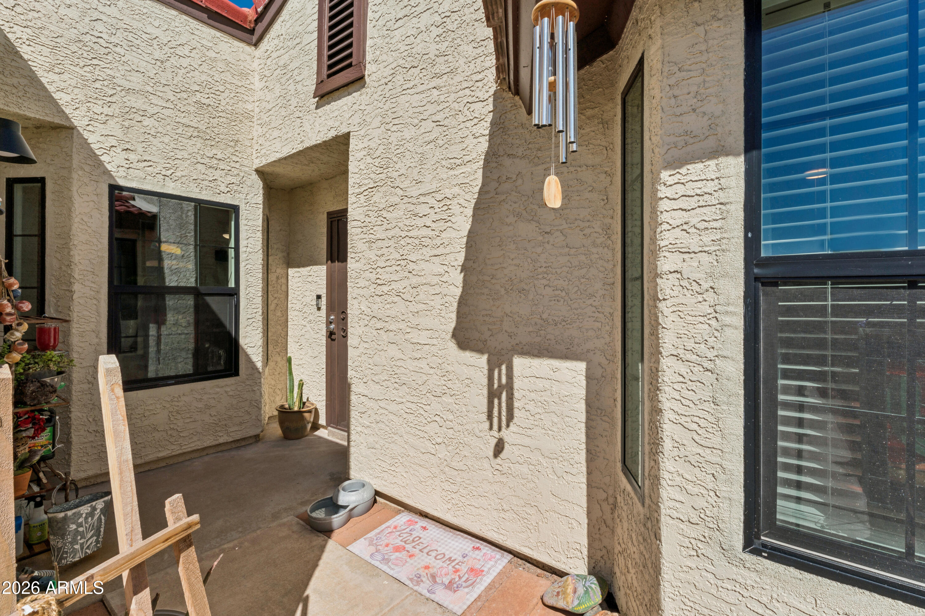 6027 South Alameda Road Gold Canyon, AZ 85118 - Photo 7 of 27 a brick building with a door and a window
