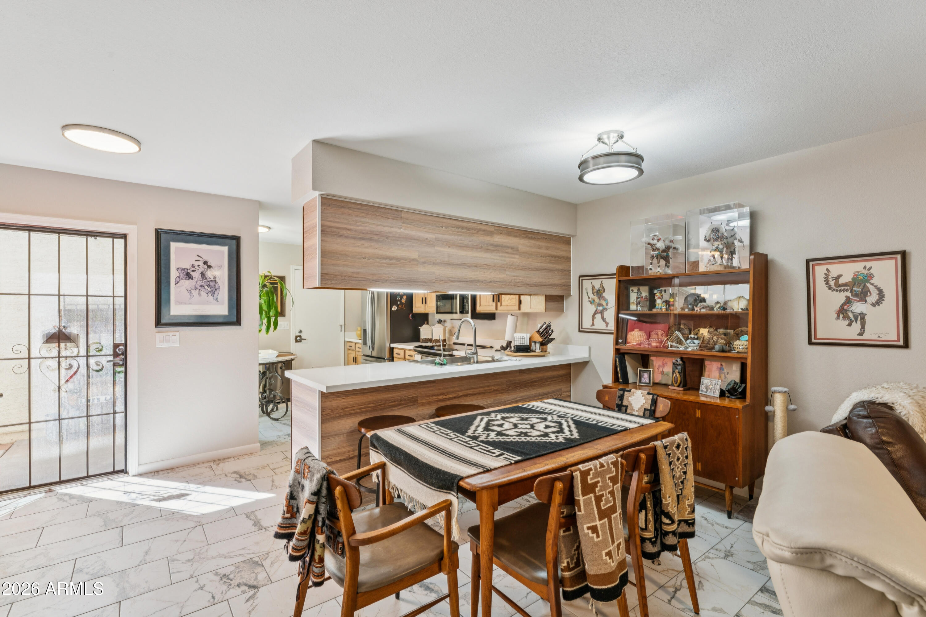 6027 South Alameda Road Gold Canyon, AZ 85118 - Photo 9 of 27 a table and chairs in a room