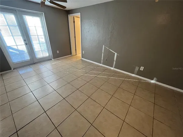 a view of an empty room and window