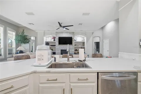 a living room with furniture fireplace and flat screen tv