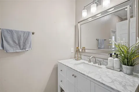 a bedroom with a bed and a flat tv screen