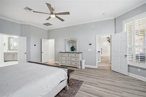 a spacious bathroom with a granite countertop sink and a mirror