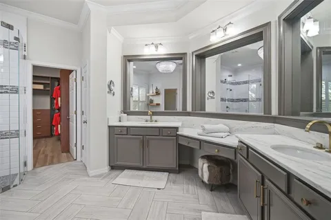 a bathroom with a granite countertop sink a toilet and shower