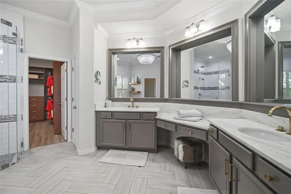 a bathroom with a granite countertop sink a toilet and shower