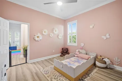 a bedroom with two beds and a window