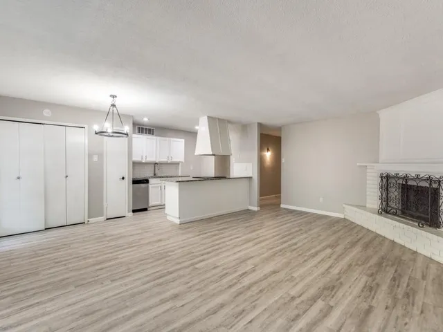 a view of a kitchen with a sink and a kitchen counter top