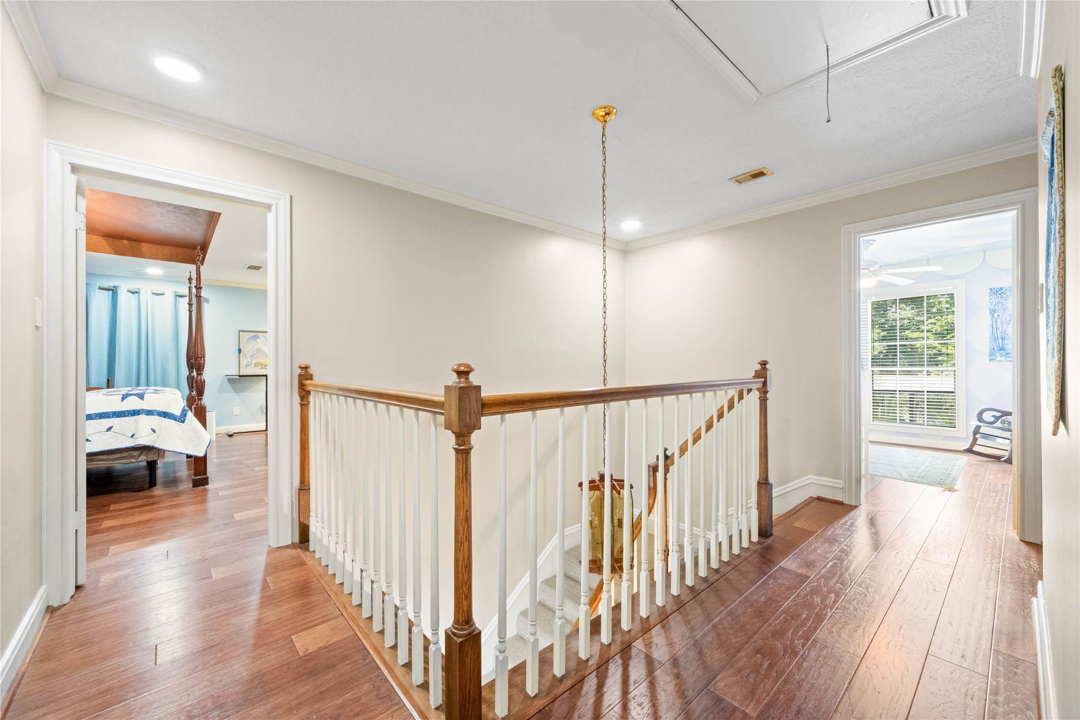 7639 Post Bridge Road Spring, TX 77389 - Photo 22 of 42 a view of a hallway view with wooden floor and staircase