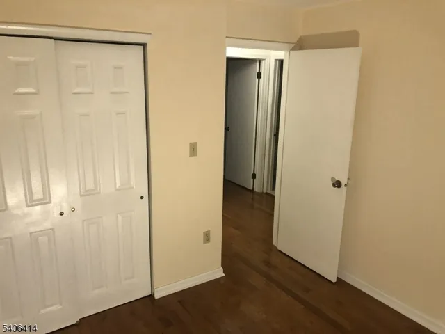 a view of a bathroom with wooden floor