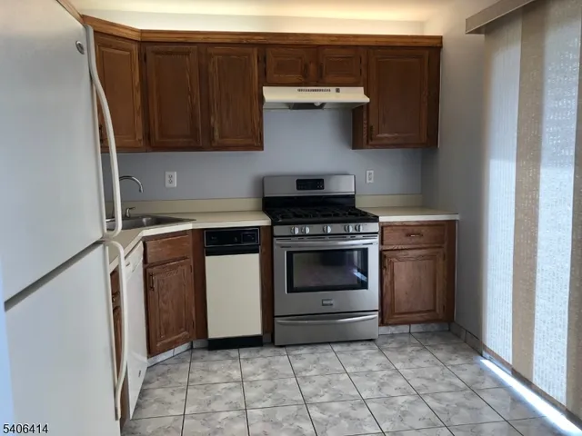 a kitchen with a stove and a sink