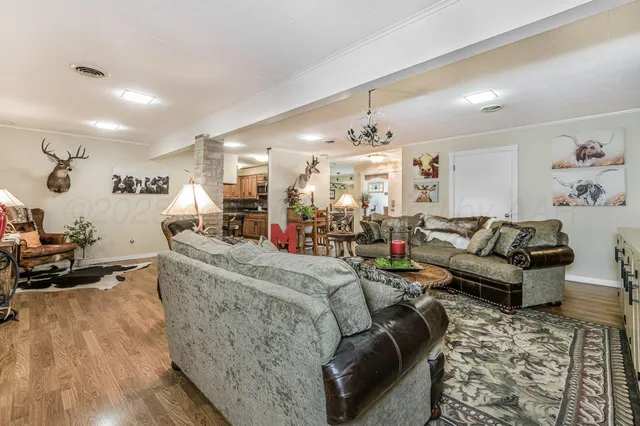 a kitchen with kitchen island a counter top space appliances and cabinets