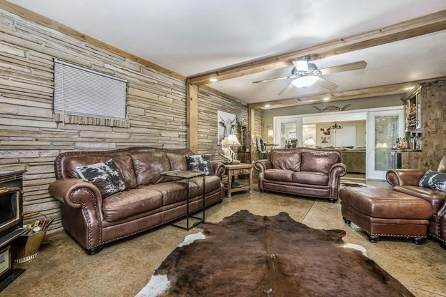 a view of living room kitchen and entryway