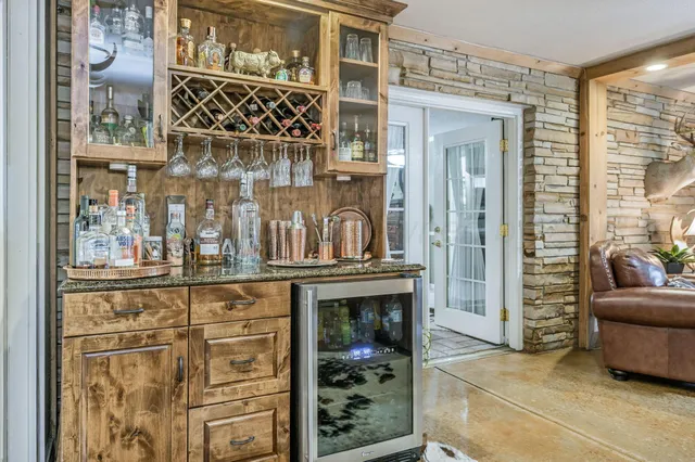 a view of a livingroom with furniture and a window