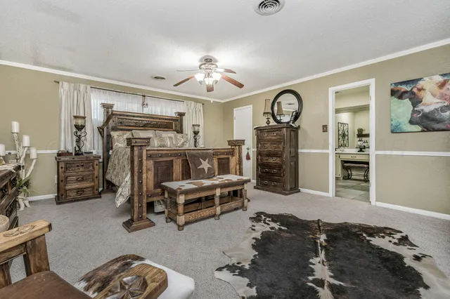 a bedroom with a bed and a dresser