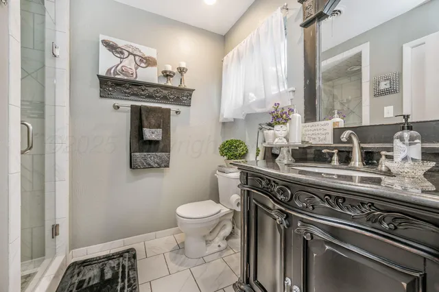 a spacious bathroom with a double vanity sink and a mirror