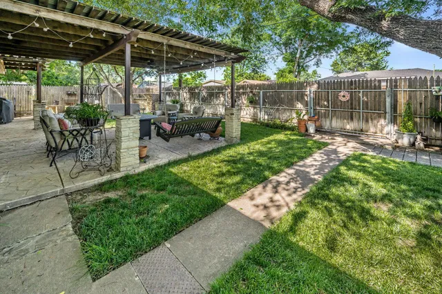 a view of yard with patio
