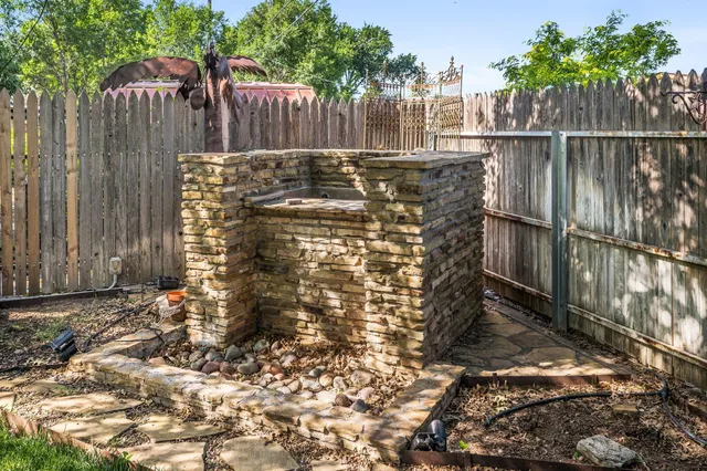 a view of outdoor space with wooden fence