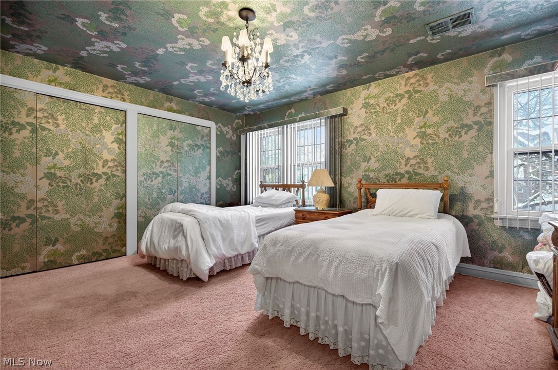 3498 Bainbridge Road Cleveland Heights, OH 44118 - Photo 31 of 50 Carpeted bedroom with a chandelier, two closets, and wallpapered walls