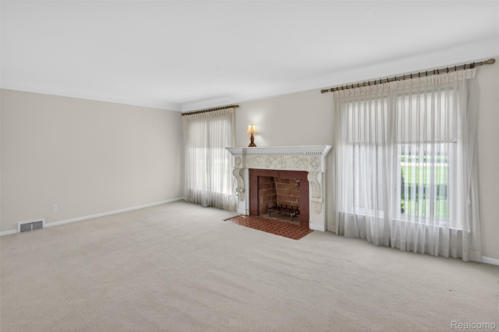 15623 Millar Road Clinton Township, MI 48036 - Photo 38 of 56 Unfurnished living room featuring carpet floors and a fireplace with flush hearth