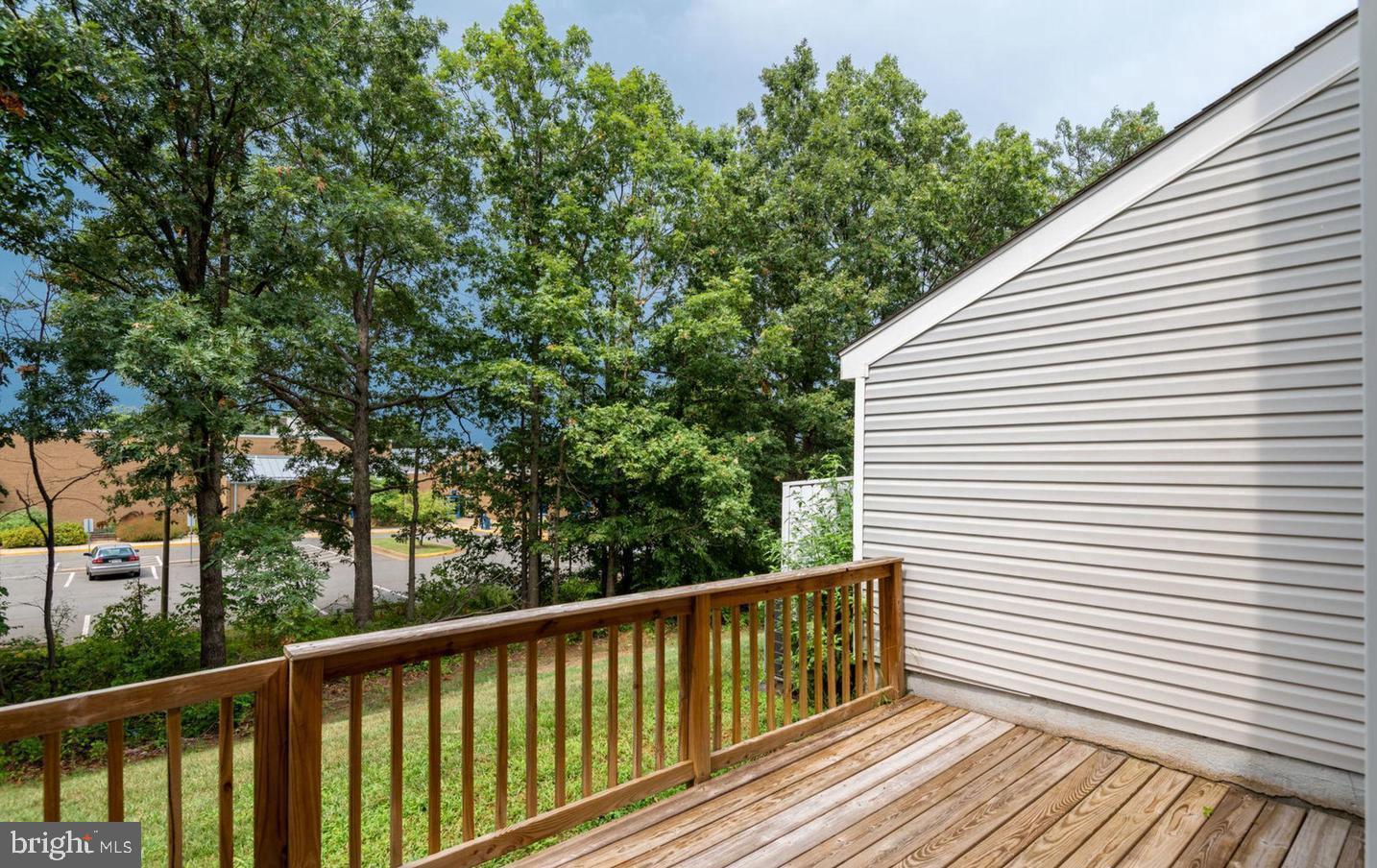 340 Lancaster Square Sterling, VA 20164 - Photo 11 of 12 a view of balcony with wooden floor and fence