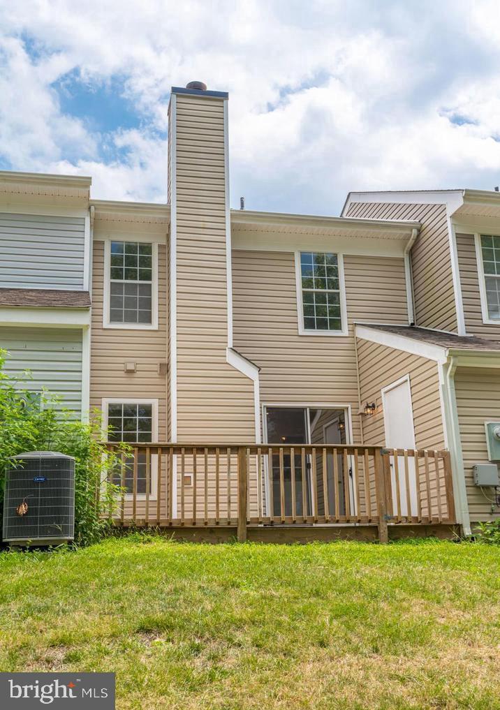 340 Lancaster Square Sterling, VA 20164 - Photo 12 of 12 a view of a house with a yard and plants