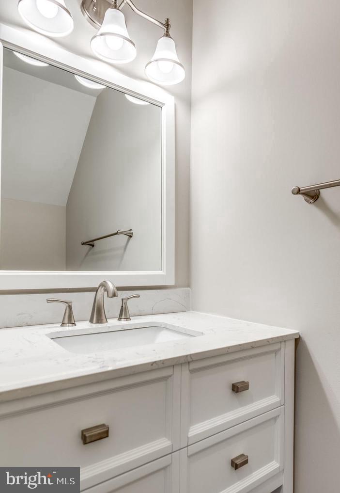 340 Lancaster Square Sterling, VA 20164 - Photo 7 of 12 a bathroom with a sink and a mirror