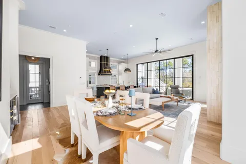 a bedroom with a large bed and a potted plant
