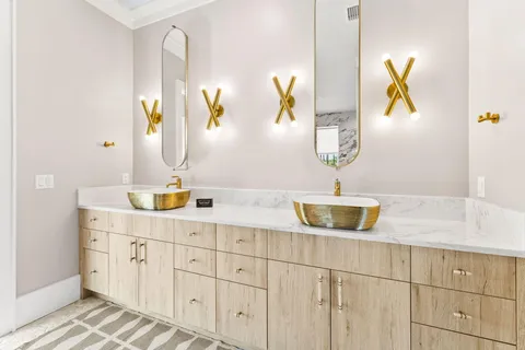 a kitchen with white cabinets sink and white appliances