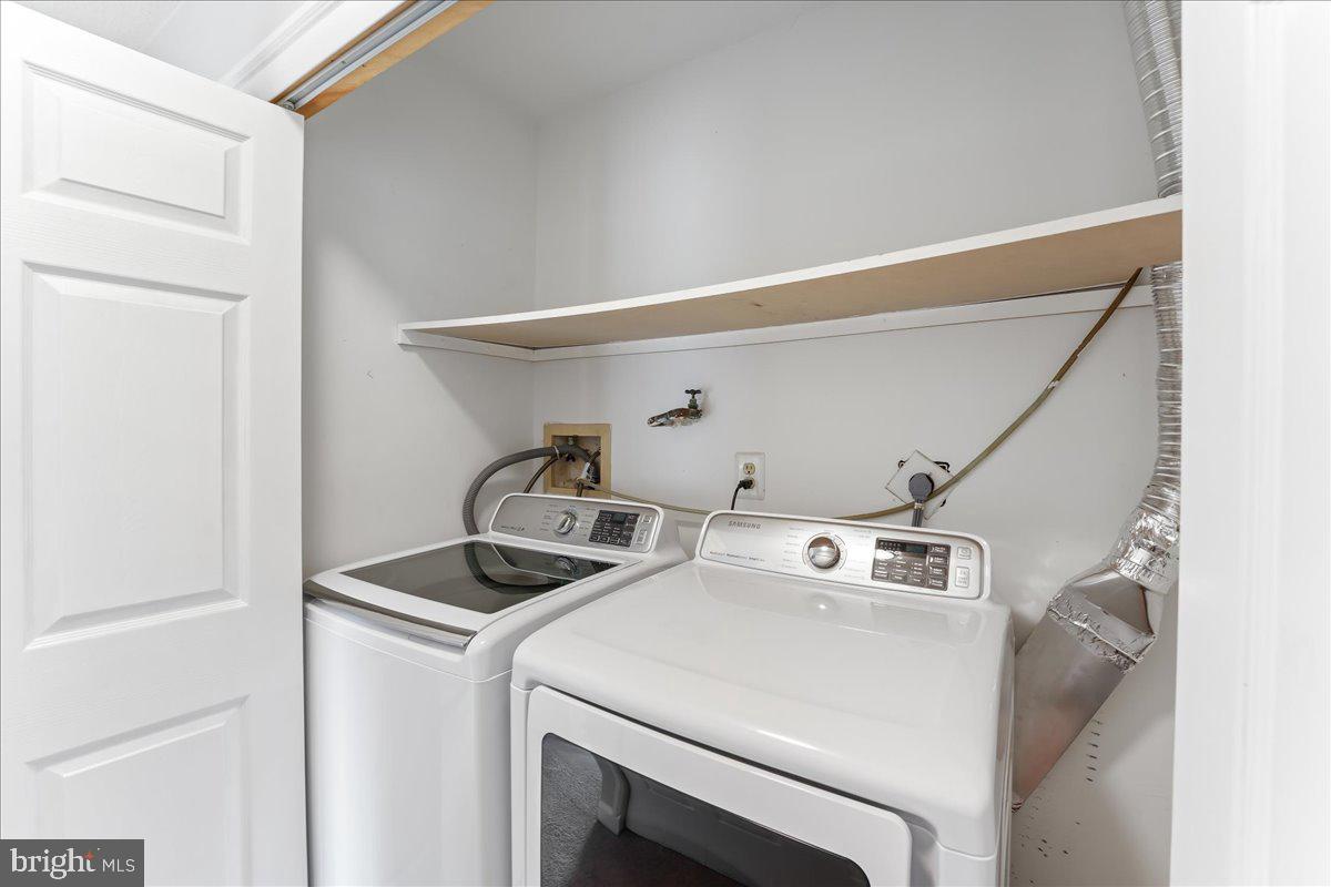 44 Witherspoon Court, Unit 137 Chesterbrook, PA 19087 - Photo 21 of 26 a utility room with dryer and washer