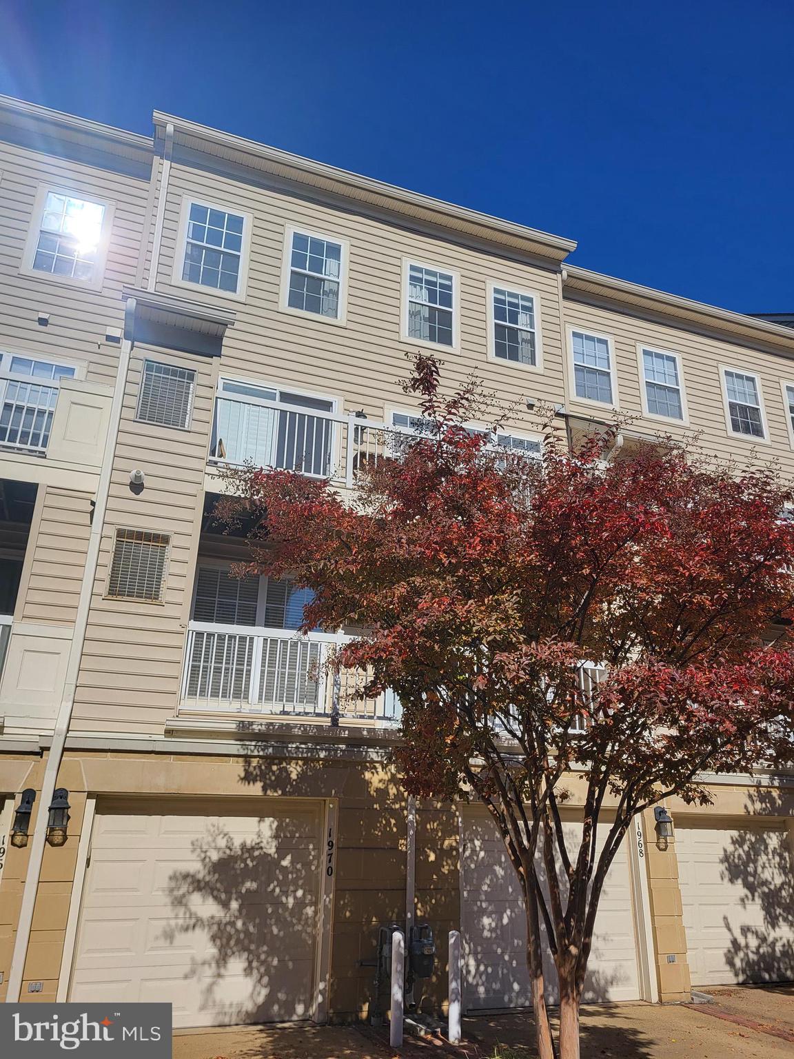 1970 Crescent Park Drive, Unit 19A Reston, VA 20190 - Photo 2 of 9 a front view of a house with garden