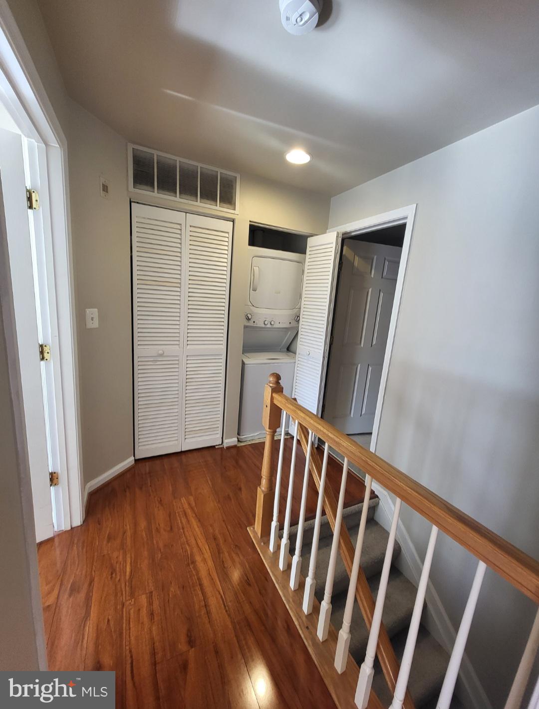 1970 Crescent Park Drive, Unit 19A Reston, VA 20190 - Photo 5 of 9 a view of an empty room with wooden floor and stairs