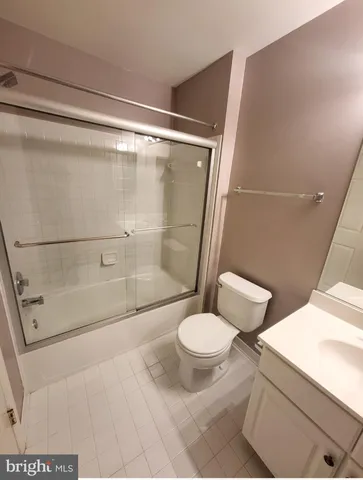 a bathroom with a shower and a toilet