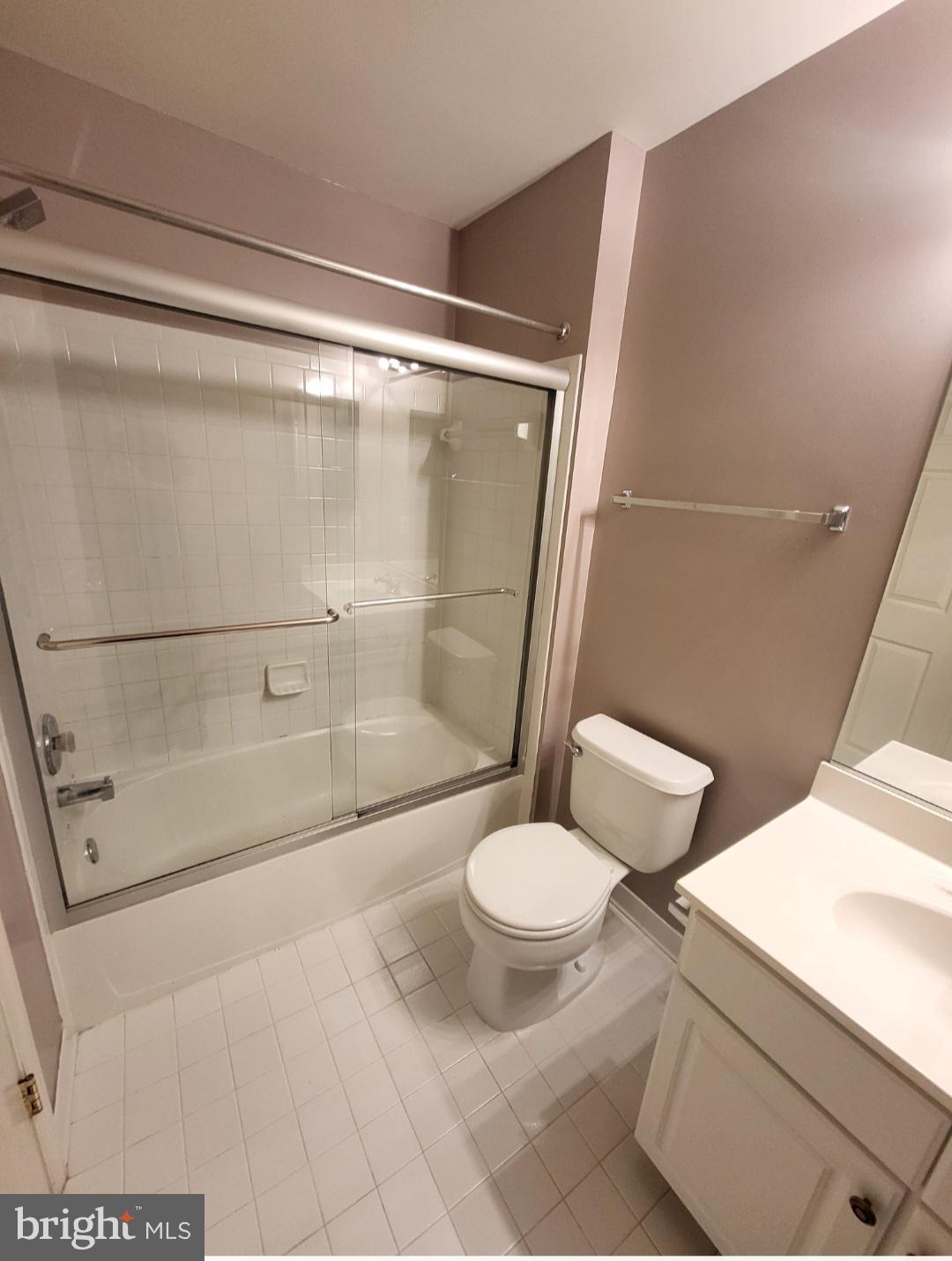 1970 Crescent Park Drive, Unit 19A Reston, VA 20190 - Photo 6 of 9 a bathroom with a shower and a toilet